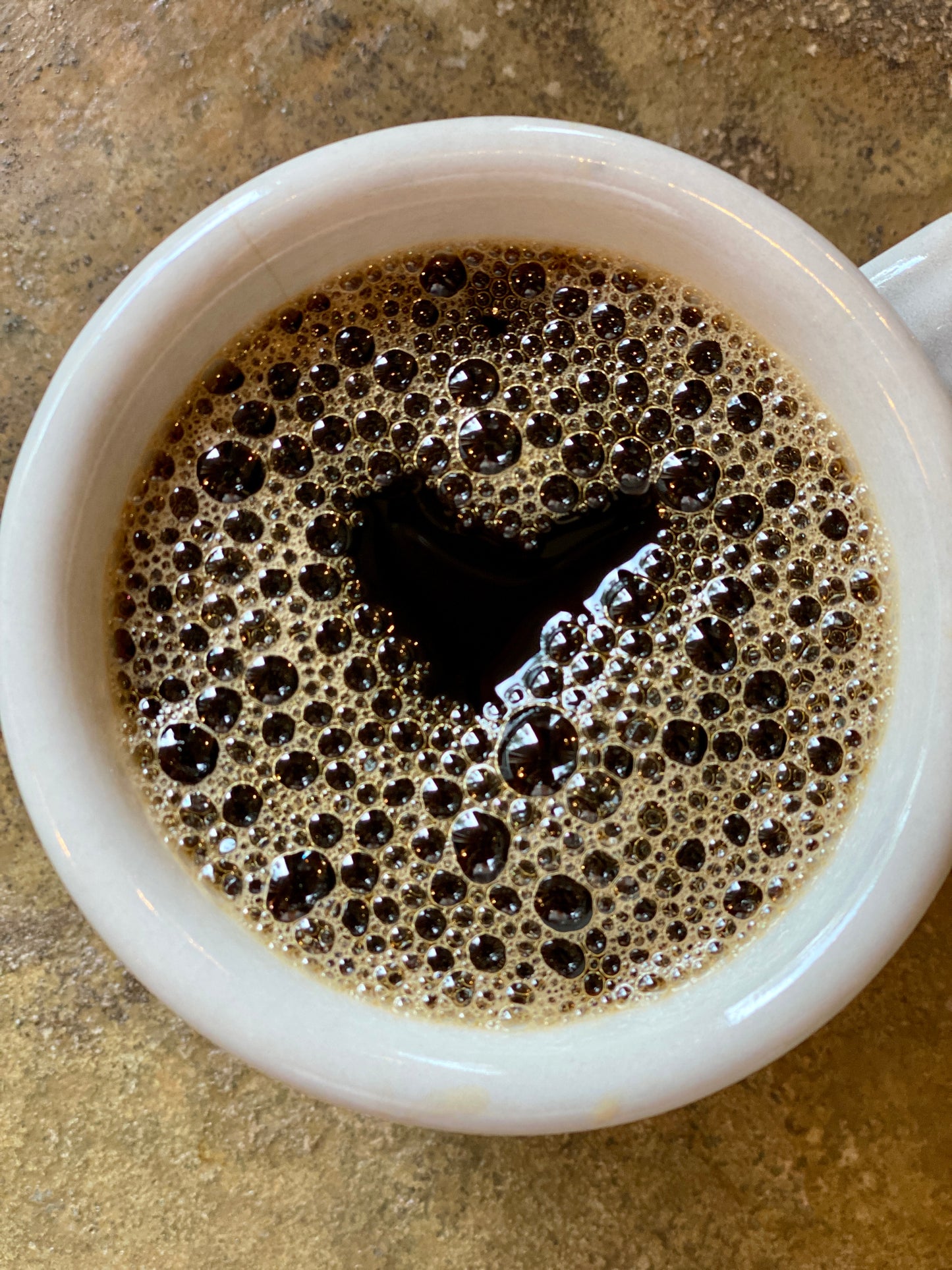 Heart Shape in a Black Cup of Coffee