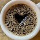Heart Shape in a Black Cup of Coffee